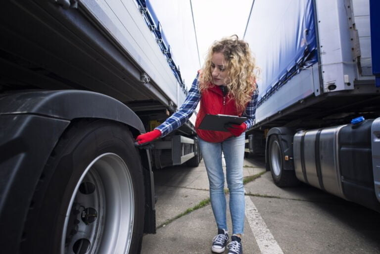 Wszystkie wiadomości - truck driver checking vehicle tires inspecting truck before ride